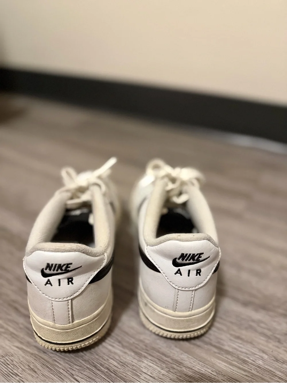 Nike White Low-Top Sneakers with Black Swoosh